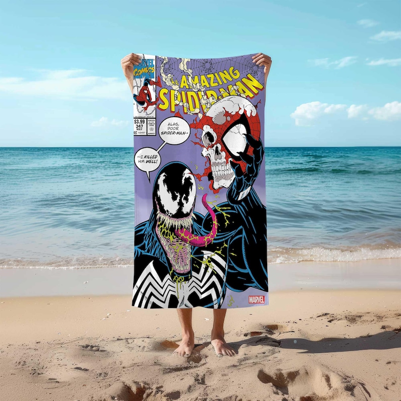 May include: A beach towel featuring a comic book cover of Amazing Spider-Man with Venom. The cover shows Spider-Man's skull with a red and black suit and Venom's face with a black and white suit. The text on the cover reads "Amazing Spider-Man" and "Alas, poor Spider-Man!" and "--I killed him, well!"