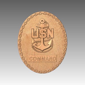May include: A wooden oval plaque with a textured surface and a chain-link border. The plaque features a detailed anchor design with the letters "USN" above it and the word "COMMAND" below. The plaque is a light brown colour.