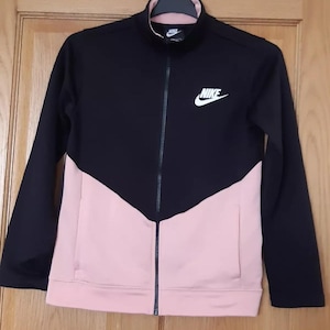 pink and black nike jumpsuit