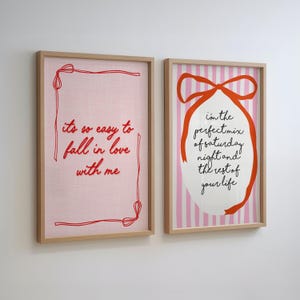 May include: Two framed art prints. One features the text "its so easy to fall in love with me" in red on a pink background. The other has the text "I'm the perfect mix of saturday night and the rest of your life" with a red ribbon design.