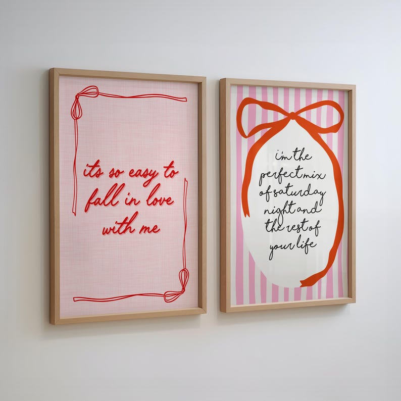 May include: Two framed art prints. One features the text "its so easy to fall in love with me" in red on a pink background. The other has the text "I'm the perfect mix of saturday night and the rest of your life" with a red ribbon design.
