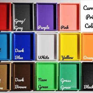 May include: A collection of small, rectangular trays in various colors, including red, gray, purple, pink, light blue, dark blue, white, yellow, orange, light brown, dark brown, neon green, grass green, and black. The text "Current Print Colors" is also present.