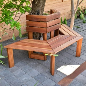 May include: A wooden bench with a unique design that wraps around a tree. The bench is made of natural wood and has a rustic look. The bench is perfect for outdoor seating and would be a great addition to any garden or patio.