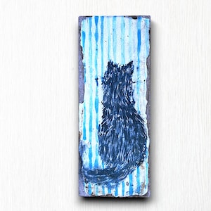 May include: A black cat silhouette painted on a blue and white striped background. The painting is on a rectangular wooden panel.