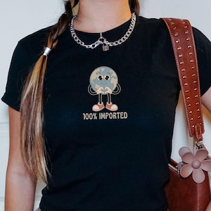 Migrant Immigrant 90s Baby Tee Retro Graphic Baby Tee Immigration Pride Y2K Tee Baby Tees Women Social Activist Crop Top Earth Save Shirt