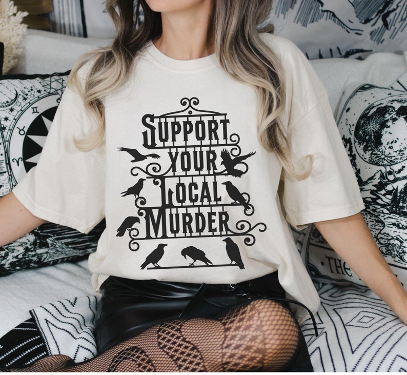 black iron gate with several crows and text Support Your Local Murder