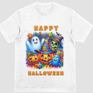 May include: White t-shirt featuring a colorful Halloween design. The graphic includes a ghost, a pumpkin with a witch hat, a skull, and the words "HAPPY HALLOWEEN". The design has a puzzle piece theme.