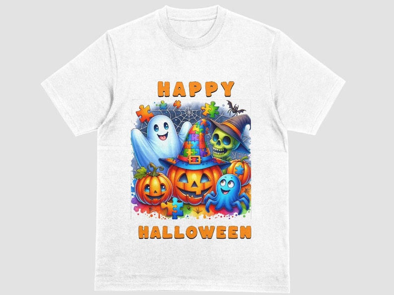 May include: White t-shirt featuring a colorful Halloween design. The graphic includes a ghost, a pumpkin with a witch hat, a skull, and the words "HAPPY HALLOWEEN". The design has a puzzle piece theme.