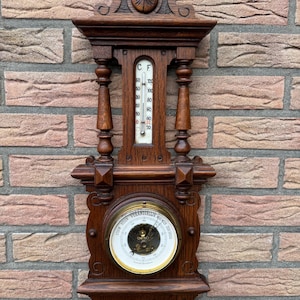 Antique weather station, aneroid barometer thermometer art deco style, made of oak. 1920s.