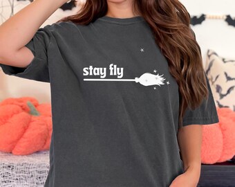 Halloween Comfort Colors T-Shirt with Stay Fly and a Witches Broom for Spooky Season, Halloween Parties, and Gifts, Wizarding World Fans