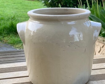 Old creamy white confit pot