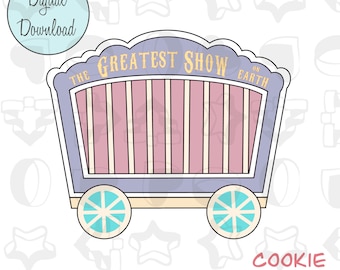 May include: A purple and pink cookie cutter shaped like a circus wagon with the text "The Greatest Show on Earth".