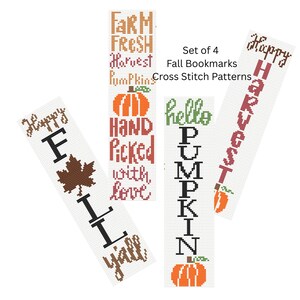 May include: Set of four fall-themed cross-stitch bookmarks. Each bookmark features a different design with fall-related words and images, including pumpkins and leaves. The color palette includes orange, brown, and green on a white background.
