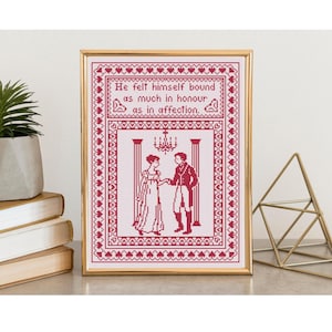 May include: Framed cross-stitch art with a gold frame. The artwork features a red and white design of a couple in period clothing, with the quote "He felt himself bound as much in honour as in affection."