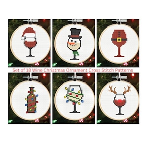 May include: Set of 18 Wine Christmas Ornament Cross Stitch Patterns. The image shows six cross-stitch patterns in embroidery hoops. Each pattern features a wine glass with a Christmas theme, including a Santa hat, snowman, and reindeer antlers.