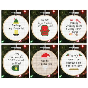 May include: Six festive cross-stitch embroidery hoops, each with a different Christmas-themed design. The hoops feature phrases and images such as an elf, a throne, candy, a coffee cup, Santa, and a nice list.