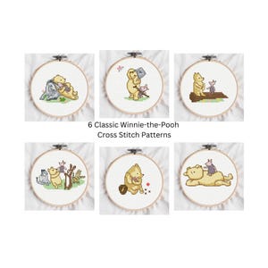 May include: Six Winnie-the-Pooh cross-stitch patterns displayed in embroidery hoops. Each hoop features a different scene with Pooh, Piglet, and other characters. The text "6 Classic Winnie-the-Pooh Cross Stitch Patterns" is below the hoops.