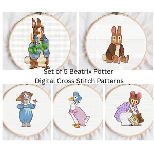 May include: A set of five cross-stitch patterns featuring characters from Beatrix Potter stories. Each design is framed in a wooden hoop. The characters include a rabbit, a duck, a cat, and a mouse, all rendered in a pixelated style.