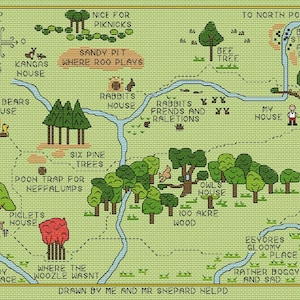 May include: A cross-stitch map of the Hundred Acre Wood, featuring locations like Rabbit's House, Owl's House, and Piglet's House. The map is in shades of green, brown, and blue, with text labels indicating various places and landmarks.