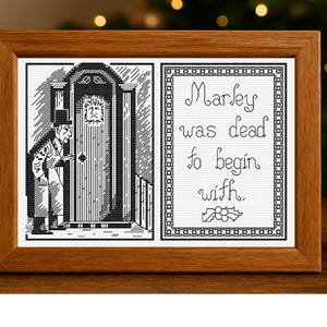 May include: A framed cross-stitch featuring a scene from "A Christmas Carol." The left panel depicts a man in a top hat and coat, while the right panel displays the text "Marley was dead to begin with." The frame is made of wood.