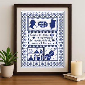 May include: Framed cross-stitch art in a dark wood frame. The design features silhouettes of a detective with a pipe and a gentleman in a top hat, along with text and other symbols in blue and white. The text reads "Come at once if convenient."