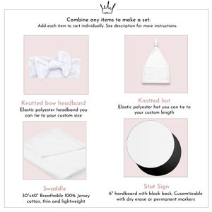 May include: An image showcasing a set of baby items. The set includes a white knotted bow headband, a white knotted hat, a white swaddle blanket (30"x40"), and a 6" hardboard stat sign with a black back.