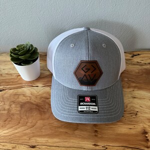 God Is Greater Than The Highs and Lows Trucker Hat
