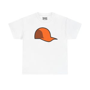 May include: White t-shirt with a cartoon image of an orange baseball cap with a brown brim. The shirt has the text "bunni BYTEZ" printed at the top. The design is centered on the front of the shirt.