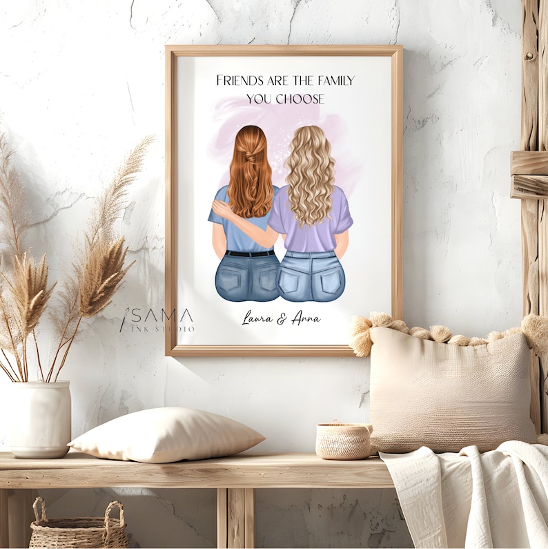 May include: A framed print with a watercolor illustration of two women with their arms around each other. The text "Friends are the family you choose" is at the top of the print. The names "Laura & Anna" are at the bottom of the print.