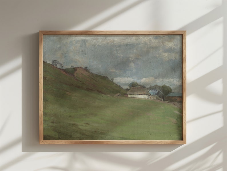 Puede incluir: Una pintura enmarcada que representa un paisaje rural con una peque&ntilde;a casa blanca y colinas verdes bajo un cielo nublado.