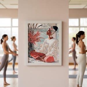 May include: A framed art print depicts a person in a white sweater and red pants, seated in a meditative pose. The artwork features a floral arrangement and a window view. The background shows people practicing yoga.