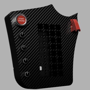May include: A black carbon fiber textured control panel featuring a circular red Start Engine button, four black rotary knobs arranged vertically, and a red flip-style toggle switch on the right side, alongside a grid of square cutouts.