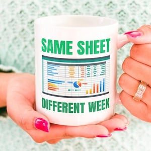 May include: White ceramic mug with a green border and text that reads "SAME SHEET DIFFERENT WEEK". The mug features a stylized image of a spreadsheet with colorful data.