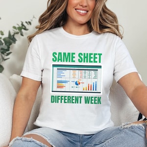 May include: White t-shirt with green text that reads "SAME SHEET DIFFERENT WEEK". The text is above a green rectangle with a spreadsheet inside. The spreadsheet has colorful charts and graphs.