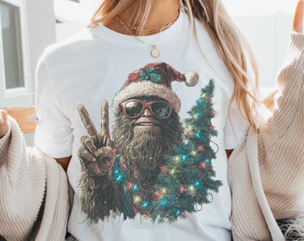 Bigfoot Christmas Unisex Tee, Sasquatch Holiday Shirt, Funny Cryptid T-Shirt, Folklore Gift, Yeti Gifts, Believe, Cryptozoology Shirt
