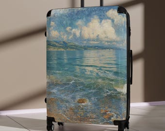 May include: A rolling suitcase featuring a scenic painting of a seascape with blue water, white clouds, and green hills. The suitcase has a black frame, handle, and wheels. The artwork depicts a beach scene.