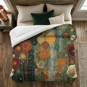 May include: A bed with a comforter featuring an abstract design of colorful circles in shades of orange, yellow, green, and brown. The comforter is on a bed with neutral-colored pillows and a dark green velvet pillow. The bed is on a wooden floor.