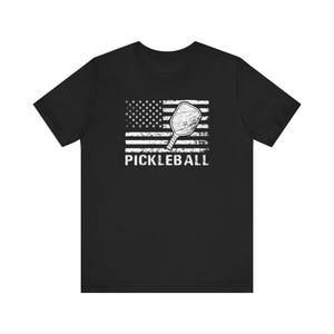 Unisex Jersey Short Sleeve Tee with American Flag & Pickleball Paddle - Patriotic Sport Design for Pickleball Players and Fans