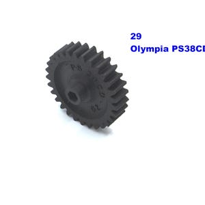 May include: Black plastic gear with 29 teeth. The gear has a central hole and is labeled "Olympia PS38CD".