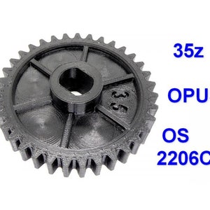 May include: A black plastic gear with 35 teeth. The gear has a central hole and is labeled "35z", "OPUS", "OS", and "2206CD".