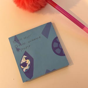 May include: A blue sticky note with a checklist that says "kill bluff", "hide evidence", and "profit". The note has a blue and white pattern.