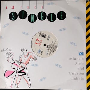 May include: A 12-inch vinyl record single with the text "SINGLE" in black circles. The record label reads "LEVERT CASANOVA" and "12 INCH". The album cover features a stylized illustration of two people dancing.