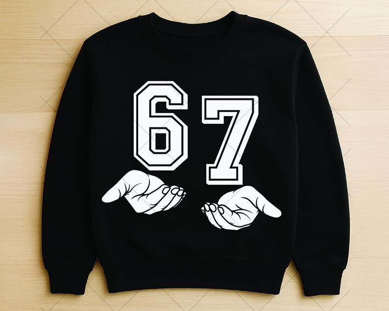 May include: Black sweatshirt with the number 67 in white, outlined in black. Below the numbers are two white hands, palms up. The sweatshirt is a crew neck style.
