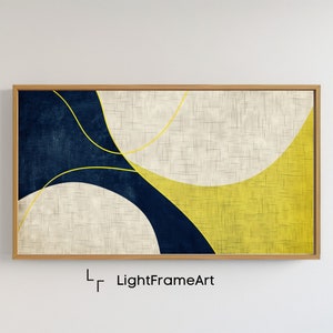 Puede incluir: Impresión de arte abstracto con un esquema de color amarillo, blanco y azul. La impresión presenta líneas curvas y formas geométricas. La impresión está enmarcada en un marco de madera claro.