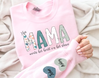 This Mama Wears Her Heart On Her Sleeve Sweatshirt, Custom Mama Sweatshirt with kids Name on Sleeve, Mother Day Gift, Custom Mama Shirt