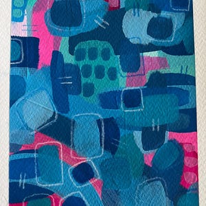 May include: Abstract painting featuring a blend of blue, teal and pink hues. The artwork incorporates a range of shapes and textures, including circles, squares and rectangles. The artist's signature, "Katie", is visible in the bottom right corner.