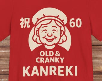 Kanreki 60th Birthday Unisex T-Shirt – Japanese 還暦 Celebration Shirt for Women | Red Cap & Robe Design for Milestone Gift