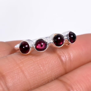 May include: A set of three ceramic nesting bowls in shades of blue, green, and white. The bowls feature a speckled glaze and a simple, modern design. The largest bowl is approximately 7 inches in diameter.