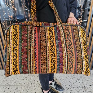 Gaziantep Treasure Trove suitcase placed against a cultural backdrop, highlighting its travel-readiness and ethnic beauty.