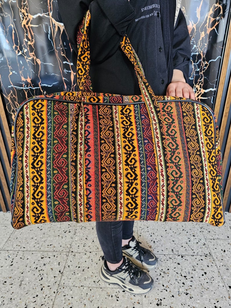 Gaziantep Treasure Trove suitcase placed against a cultural backdrop, highlighting its travel-readiness and ethnic beauty.